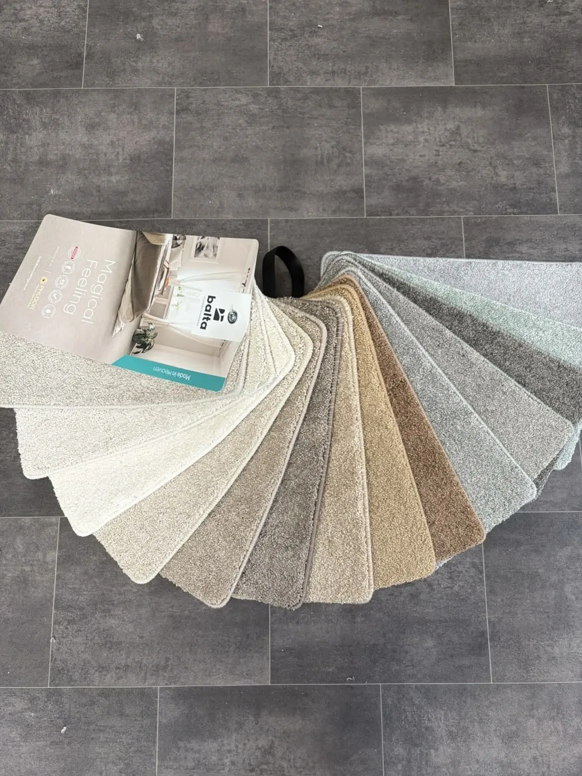Fan of flooring samples displayed in the Antrim showroom