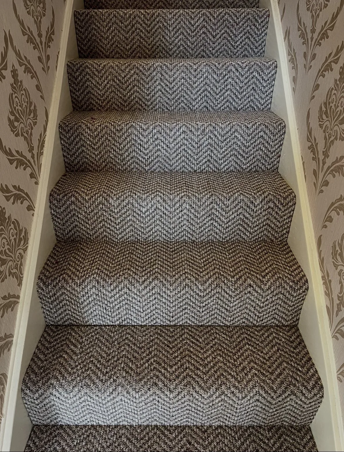 Textured neutral carpet fitted to a staircase